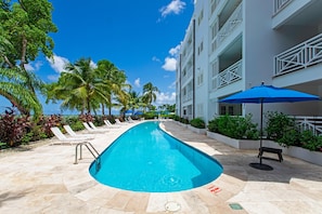 Outdoor pool, pool umbrellas, pool loungers