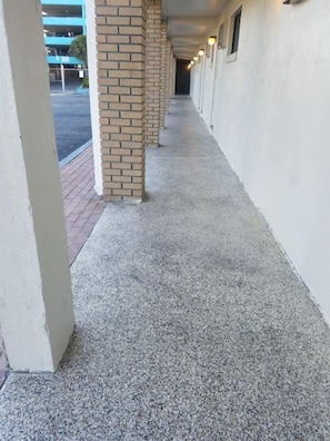 Corridors lead to parking spaces in this property.