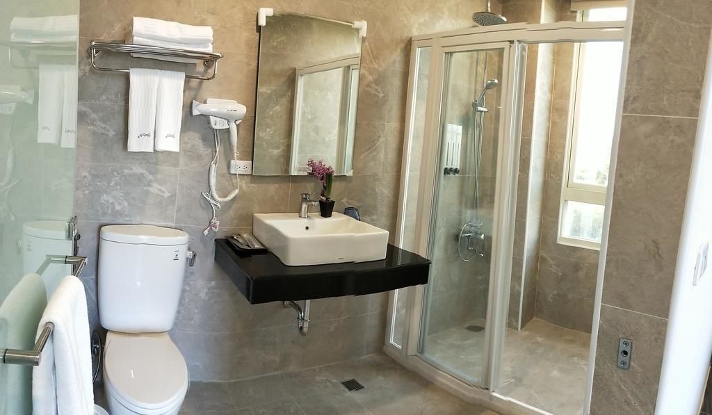 Shower, free toiletries, hair dryer, slippers