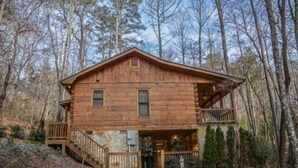 A wooden cabin with a balcony, surrounded by trees. - Indian Rock Lake (Blue Ridge)