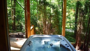 A hot tub in a forested area with wooden deck and natural surroundings. - Indian Rock Lake (Blue Ridge)