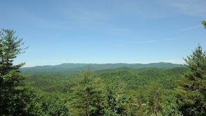 A forested mountain landscape with a clear sky. - Three Bears Bluff (Cherry Log)