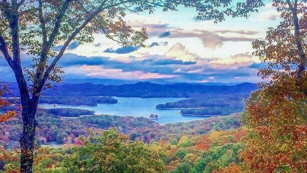 A landscape with a lake surrounded by hills and trees. - Lake Blue View (Blue Ridge)
