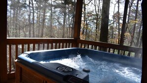 A hot tub on a wooden deck with a forest view. - Serendipity (Blue Ridge)