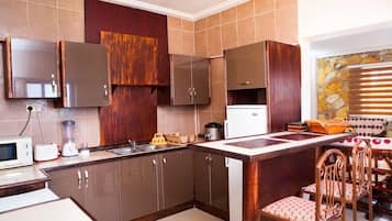 Apartment, 1 Queen Bed | Private kitchen | Full-sized fridge, microwave, oven, stovetop