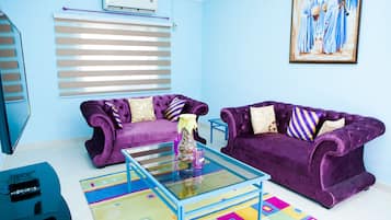 Exclusive Apartment, 2 Double Beds | Living room | Flat-screen TV