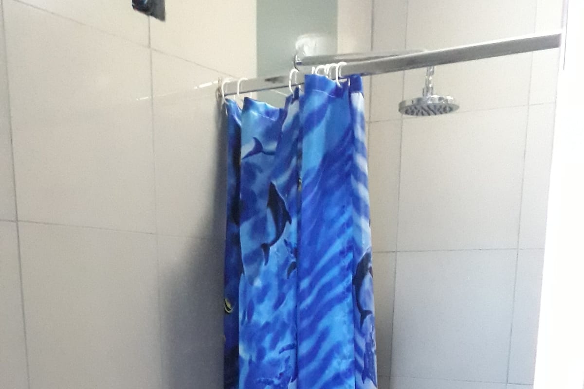 Shower, rainfall showerhead, towels, soap