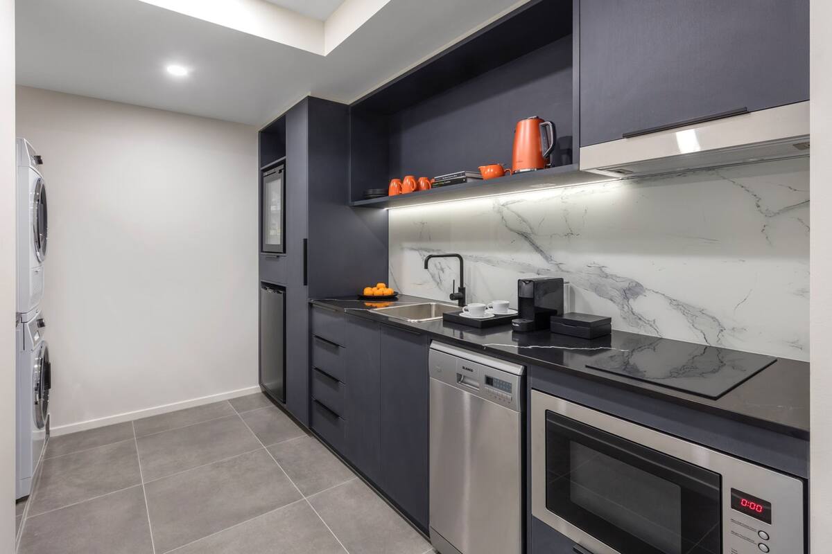 two bedroom apartment suite | private kitchen | espresso maker, coffee/tea maker, electric kettle, cleaning supplies