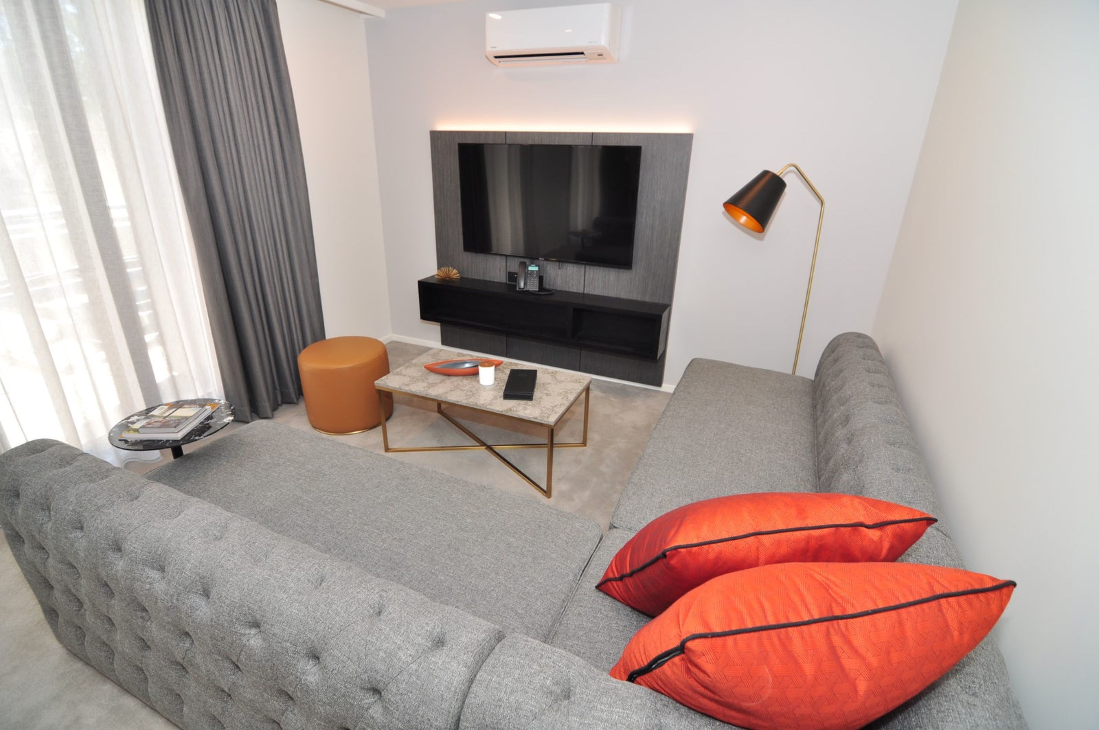 two bedroom apartment suite | living area | 55-inch lcd tv with digital channels, tv, pay films