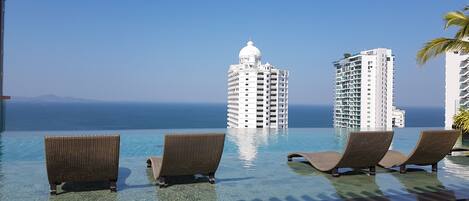 Indoor pool, 3 outdoor pools, open 7:30 AM to 8:00 AM, free pool cabanas