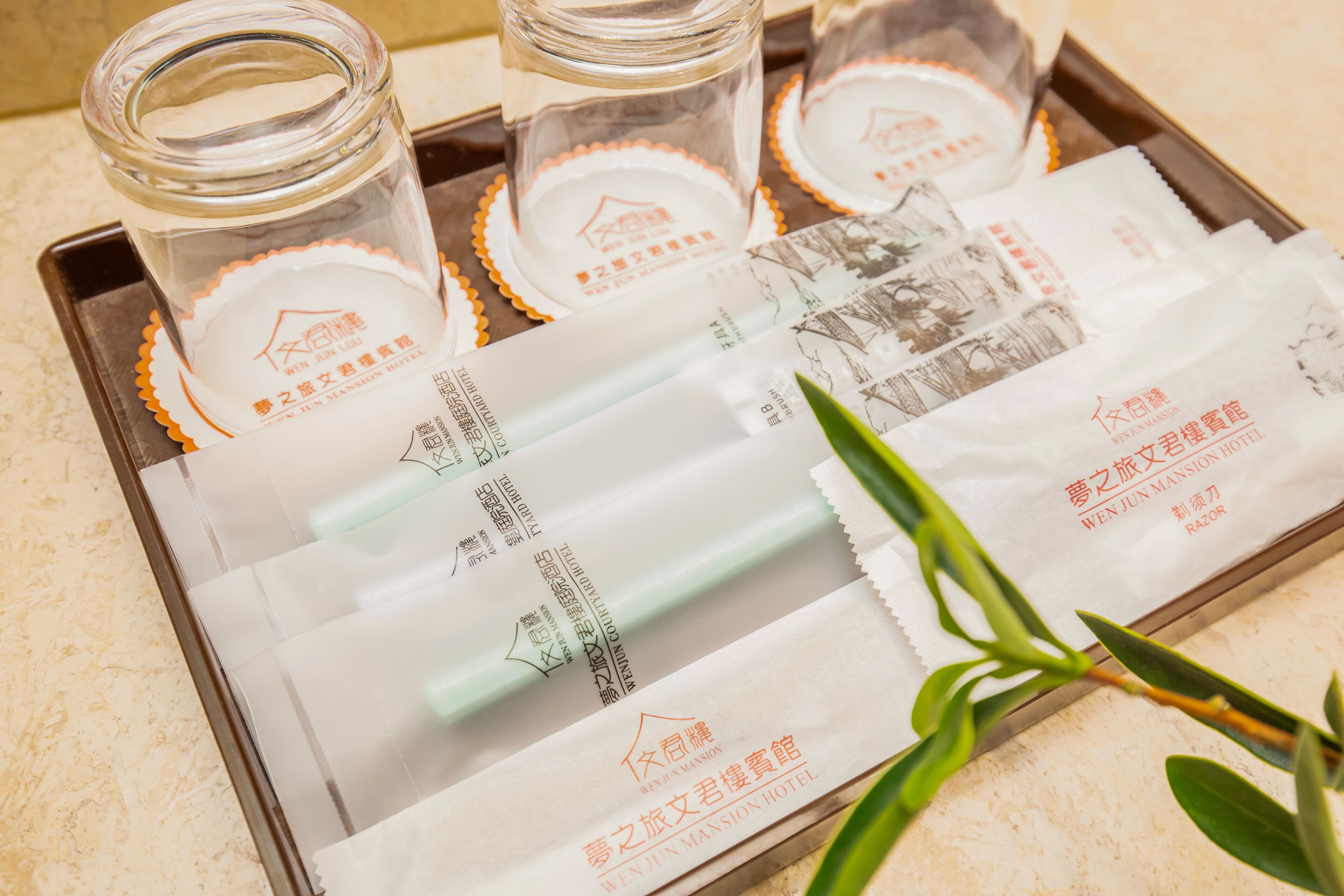 designer toiletries, hair dryer, slippers, towels