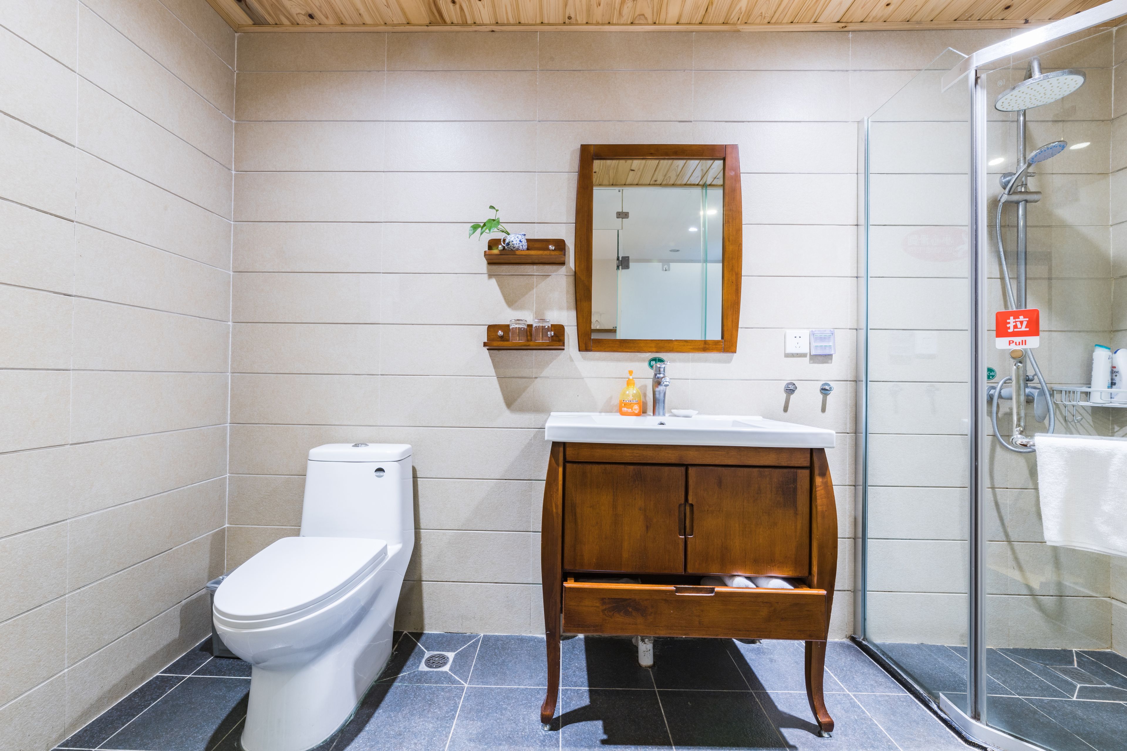 designer toiletries, hair dryer, slippers, towels