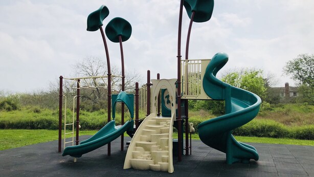 A playground with slides and climbing structures. - Seaside Villa by the Oso Bay Comfortable Bed! (Corpus Christi)