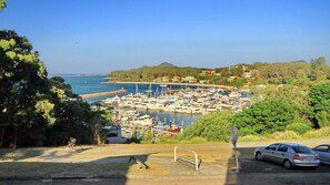 Stunning marina views surround this waterfront property, offering easy access to the road and scenic cycling routes.