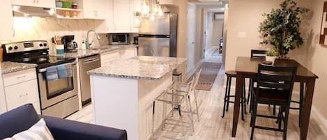 Coffee/tea maker, fridge, microwave, oven