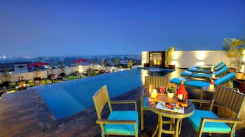 Indoor pool, open 7:00 AM to 7:00 PM, pool loungers