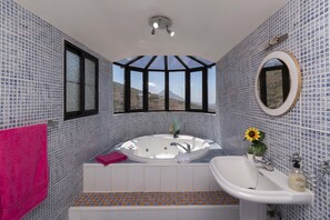 Bathtub, hair dryer, towels