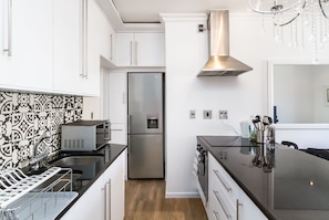 Premier Apartment, 2 Bedrooms, Beach View | Private kitchen | Fridge, microwave, oven, stovetop