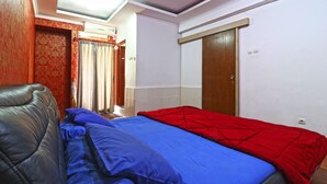 A room with a bed, a sofa, and a wardrobe. - Inkubus Gateway Apartment Ahmad Yani by Ridwan (Bandung)