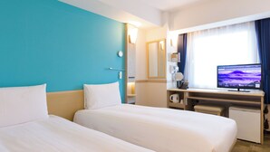 A hotel room with two beds, a desk with a computer, a coffee maker, and a window with curtains. - Toyoko Inn Osaka Hankyu Juso Station Nishi 2 (Osaka)