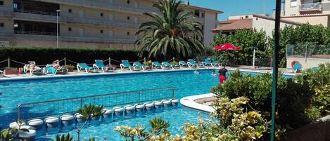 Outdoor pool, pool umbrellas, pool loungers