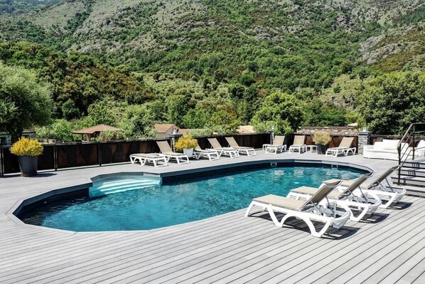 Seasonal outdoor pool, pool umbrellas, pool loungers