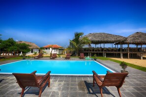 Outdoor pool, open 6:00 AM to 8:00 PM, pool umbrellas, pool loungers