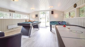 A room with a pool table, foosball table, and a billiards table. - 3 bedroom beautiful home in Ans By (Ans By)