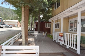 Sit on the porch and enjoy the view of the surrounding neighborhood.