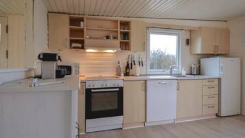 Fridge, stovetop, dishwasher, coffee/tea maker