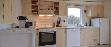 Fridge, stovetop, dishwasher, coffee/tea maker