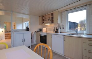 Fridge, stovetop, dishwasher, coffee/tea maker