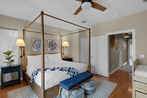 A four-poster bed with a canopy, bedside lamps, and a bench. - Stay directly on 30A! Beautiful Beach House with private courtyard and panoramic views! Short walks to beach, pool, Rosemary and Alys! (Panama City Beach)