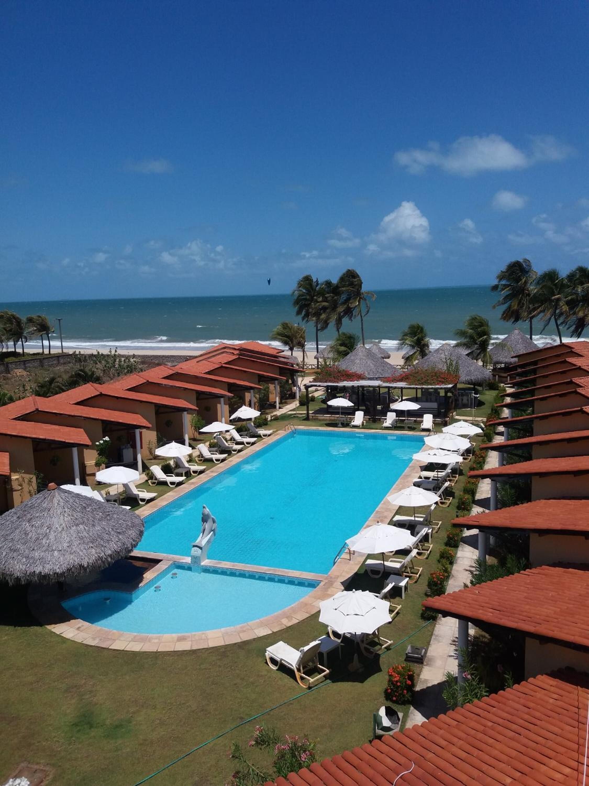 outdoor pool, open 8:00 am to 8:00 pm, pool umbrellas, pool loungers