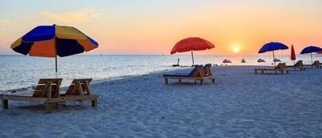 On the beach, sun loungers, beach towels