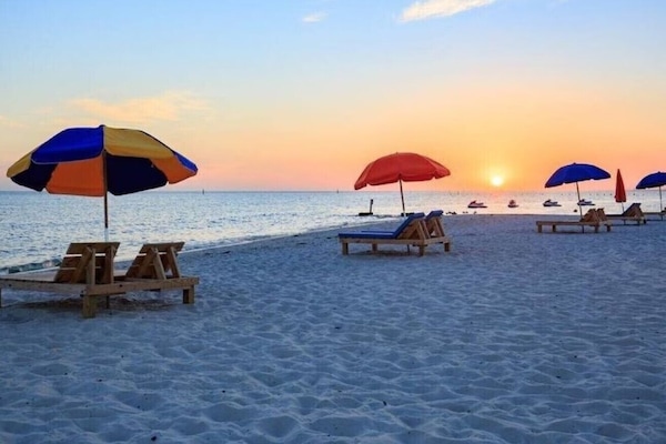 On the beach, sun loungers, beach towels