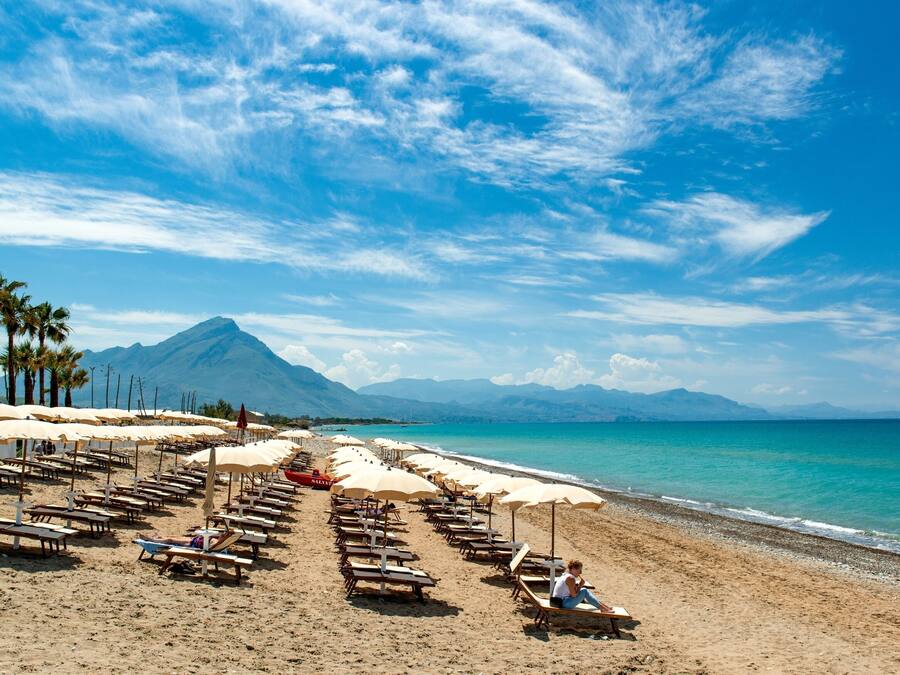 Private beach, black sand, sun loungers, beach umbrellas