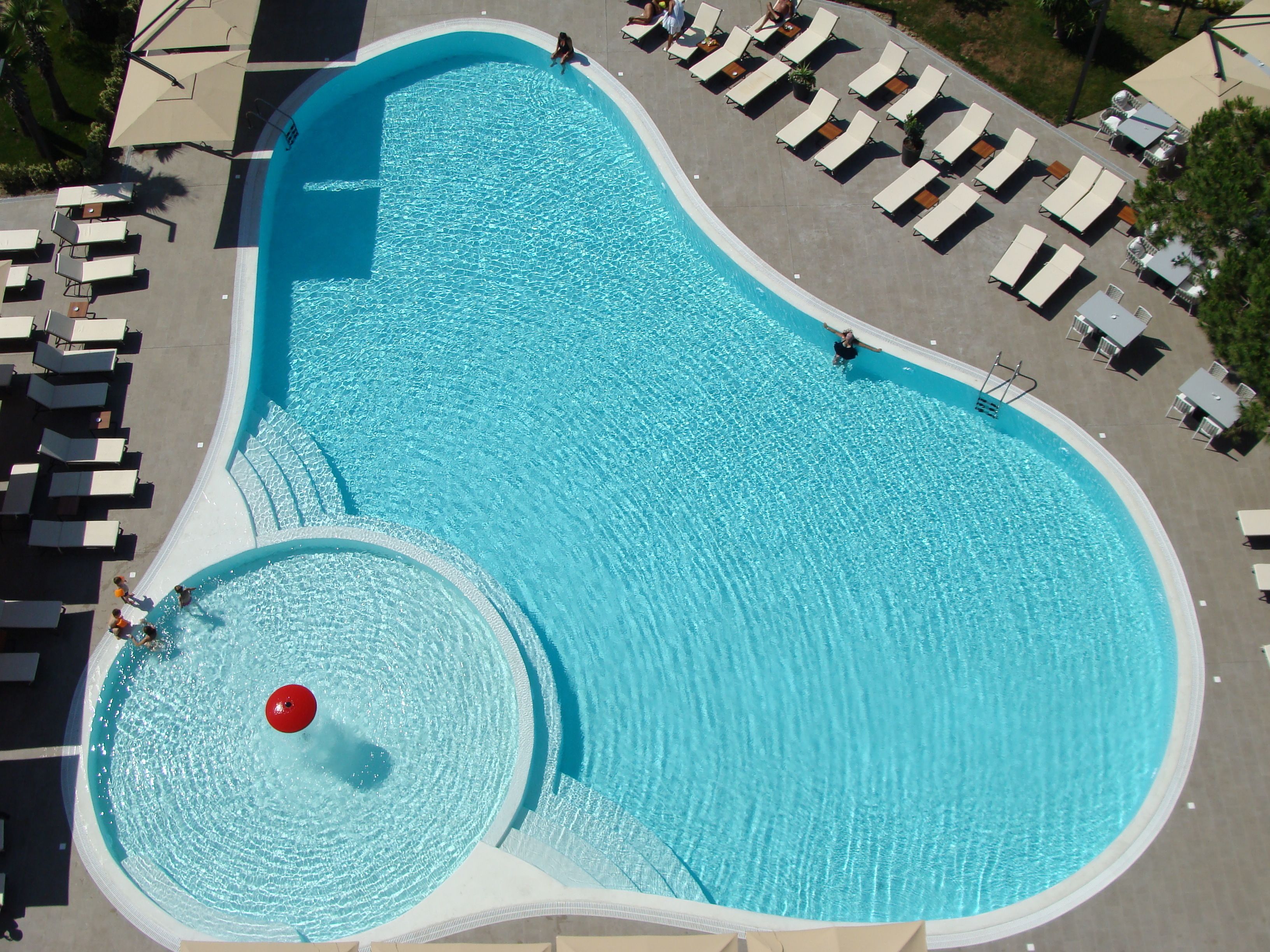 Outdoor pool, open 8:00 AM to 7:00 PM, pool umbrellas