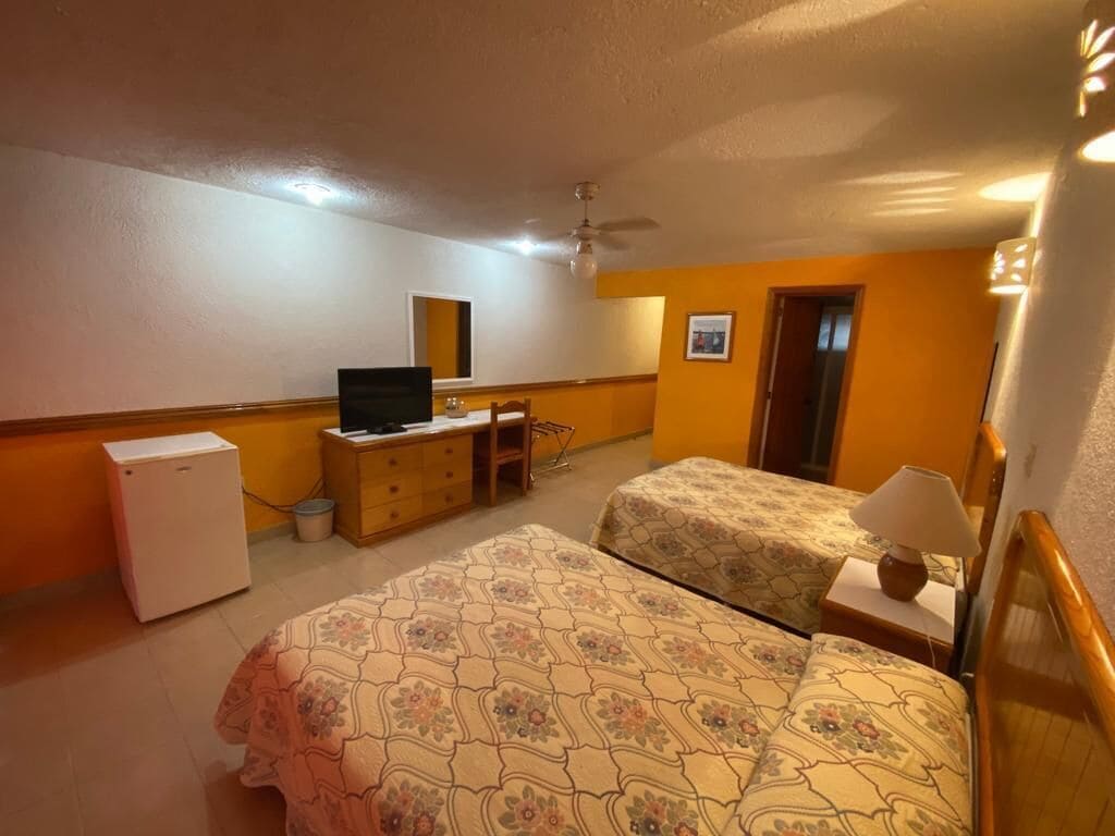 standard quadruple room, 2 double beds | 1 bedroom, down duvets, laptop workspace, iron/ironing board