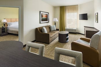 Premium bedding, desk, laptop workspace, blackout drapes at Candlewood Suites Orlando - Lake Buena Vista by IHG