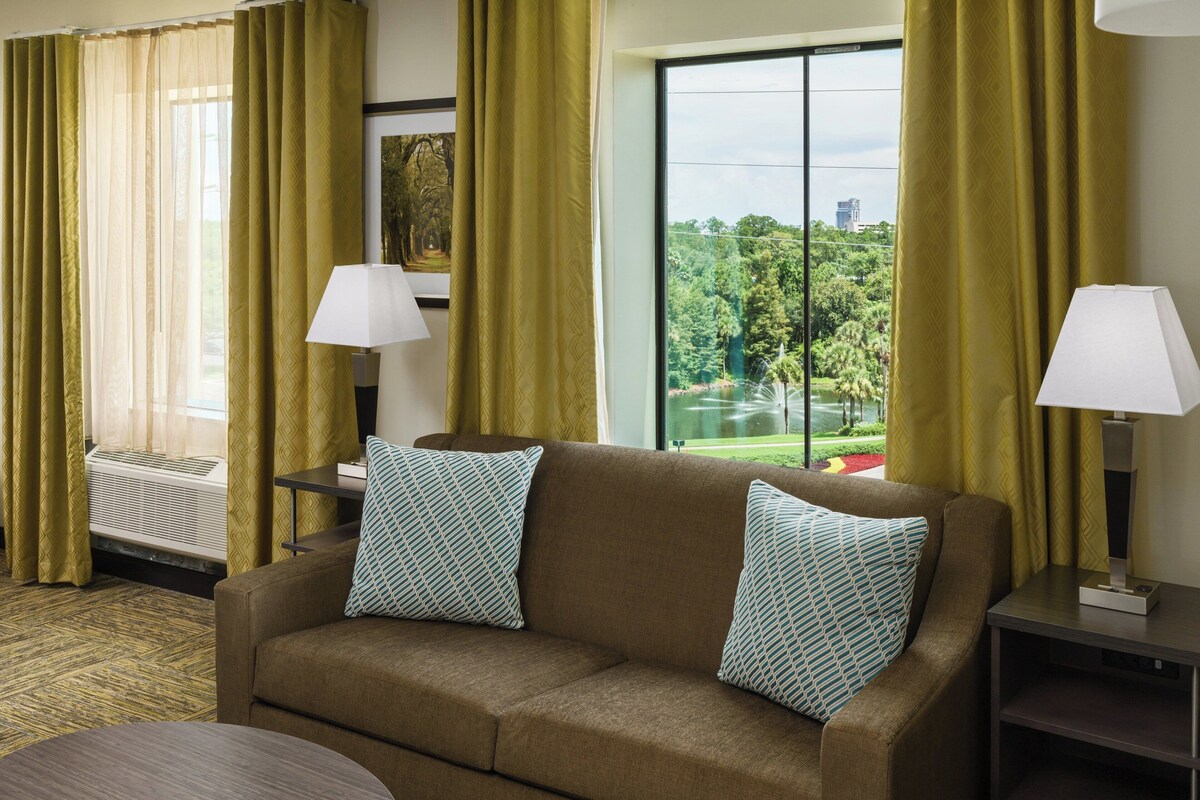 Premium bedding, desk, laptop workspace, blackout curtains