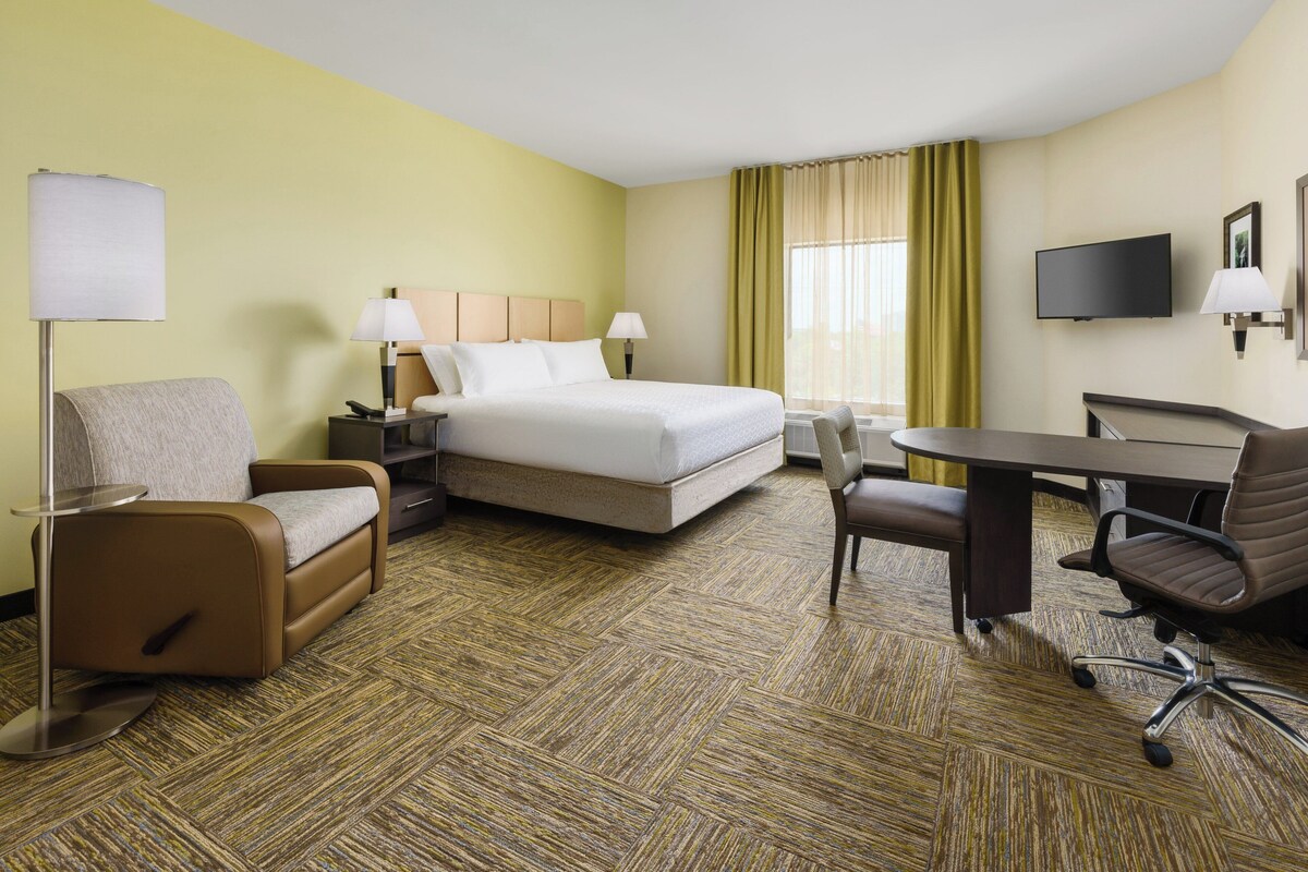 Premium bedding, desk, laptop workspace, blackout curtains