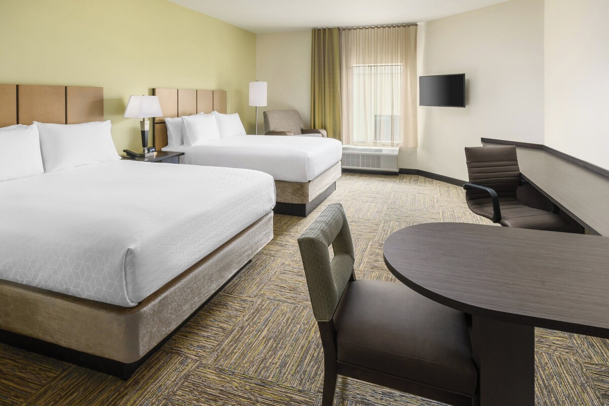 Premium bedding, desk, laptop workspace, blackout curtains