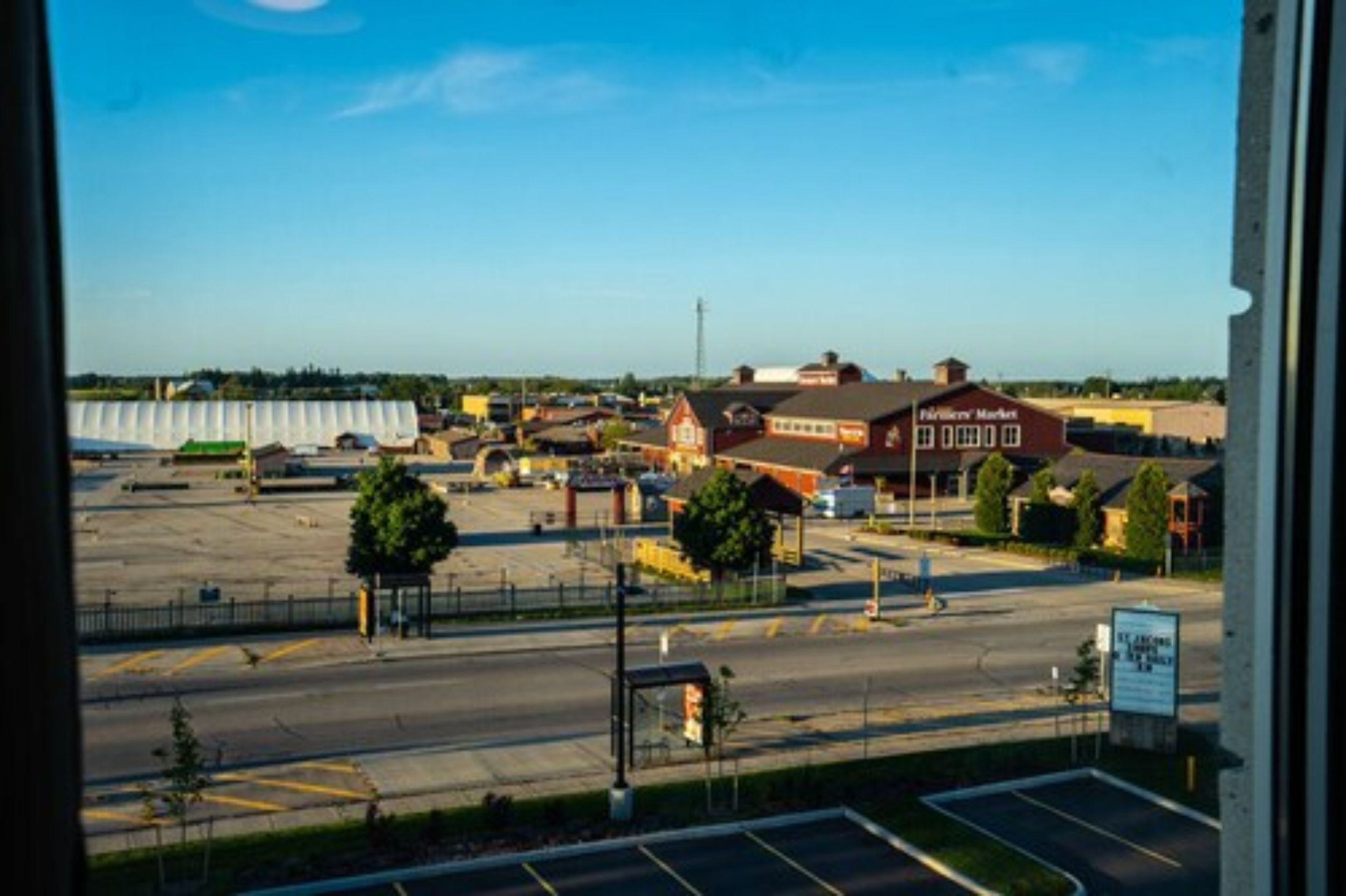 A parking lot with a building labeled "Fisher's Market" in the background.