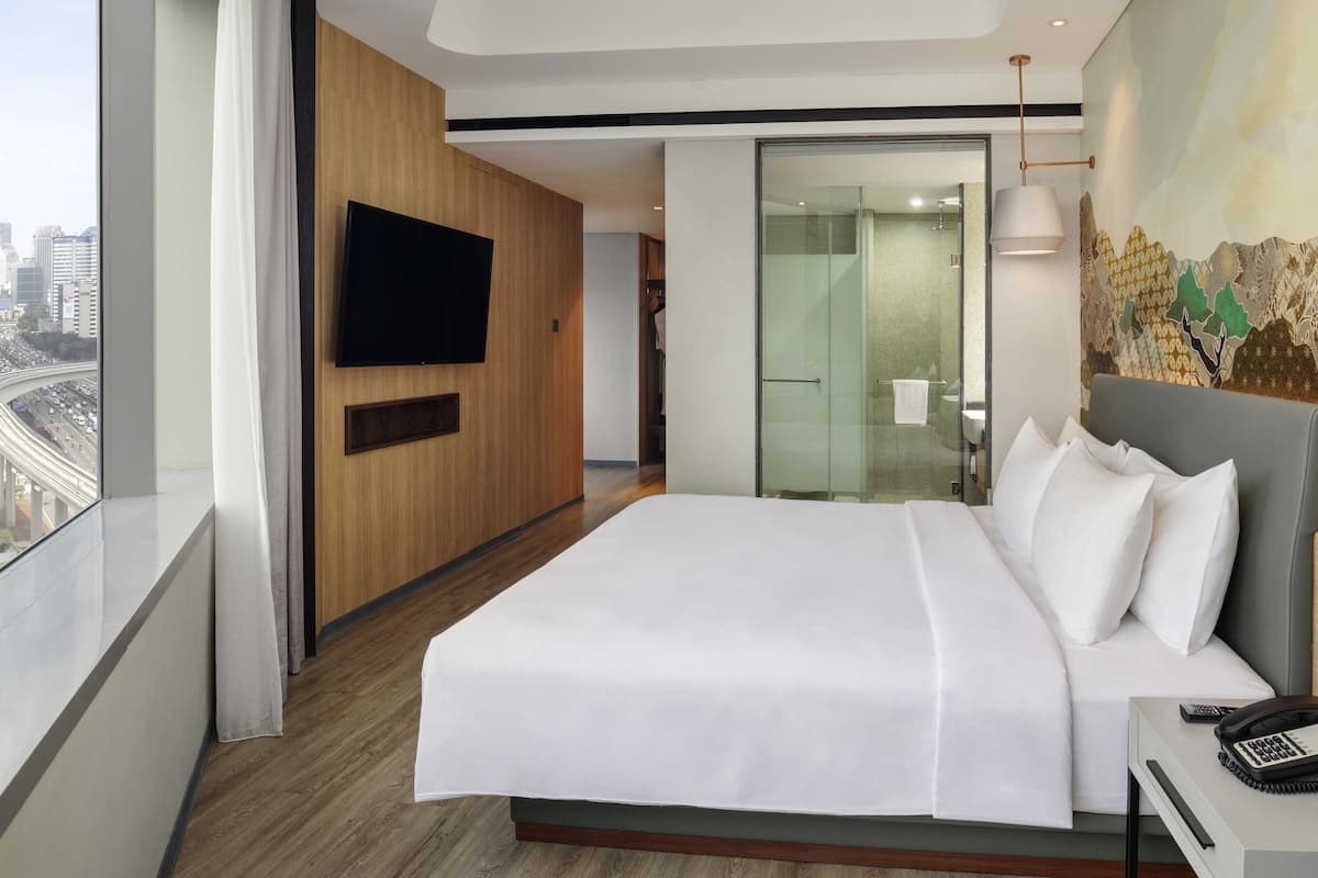 Estúdio executivo, 1 cama de casal | Camas Select Comfort, frigobar, cofres nos quartos, escrivaninha