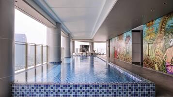 Indoor pool, open 6:00 AM to 7:30 PM, pool loungers