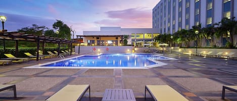 Outdoor pool, open 6:00 AM to 11:00 PM, pool umbrellas, sun loungers