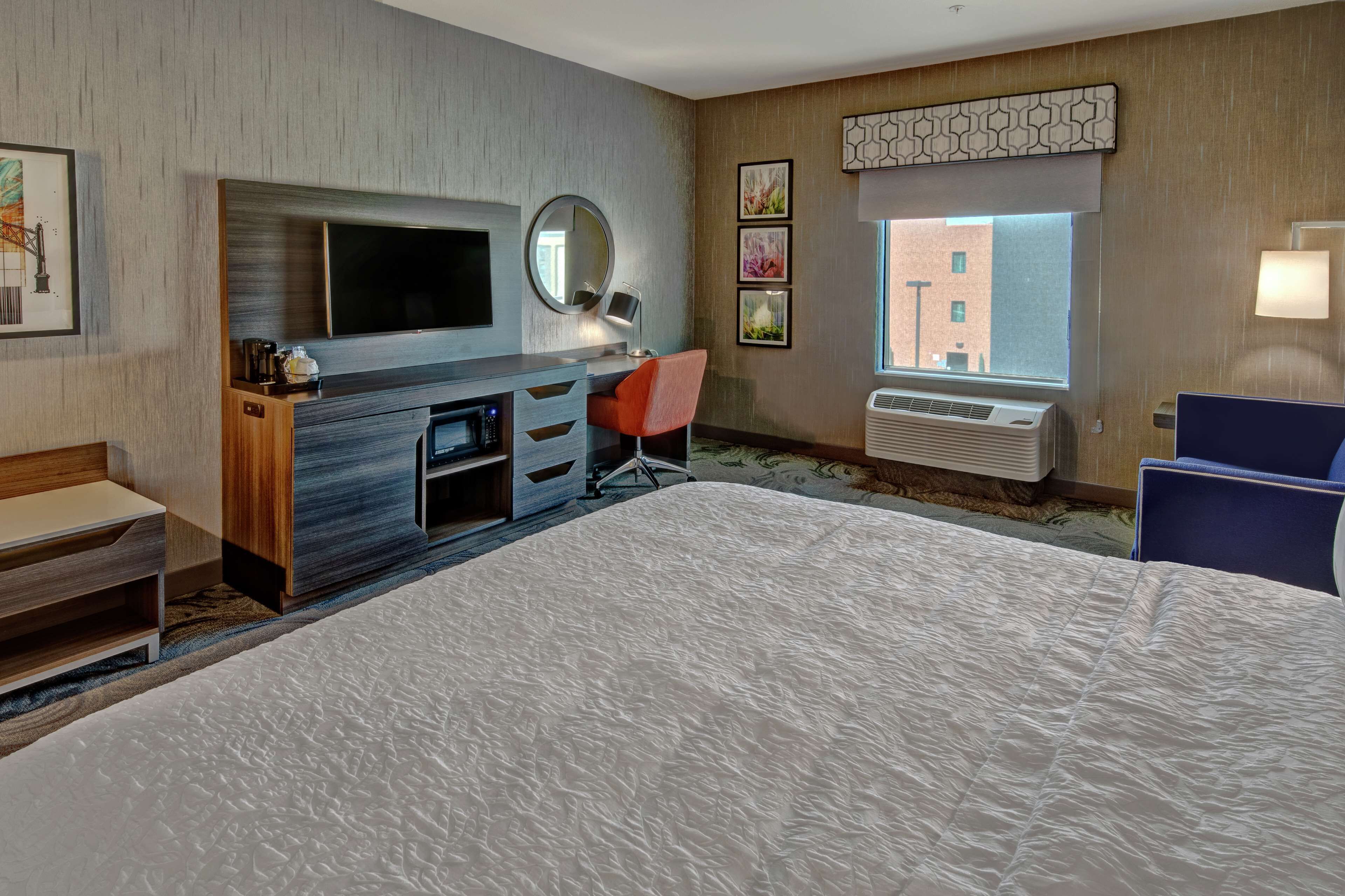 room, 1 king bed with sofa bed, refrigerator & microwave | desk, blackout curtains, iron/ironing board, free cots/infant beds