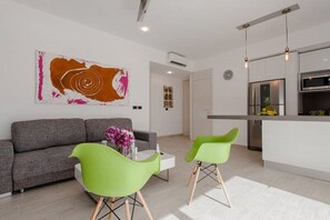 Apartment, 1 Bedroom | Living area | Flat-screen TV