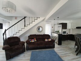 Family Villa | Living area | 52-cm LCD TV with cable channels, TV